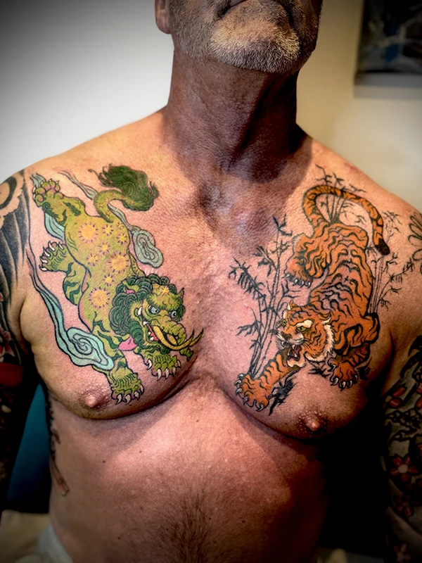 A Chest tattoo of a Baku and a Tiger in Japanese Style